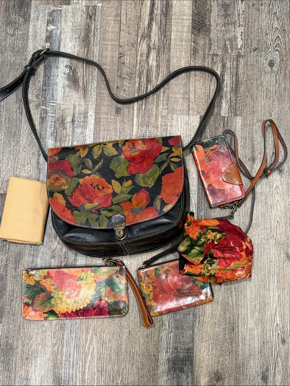 Patricia Nash crossbody leather bag in Winter Bloom with accessories